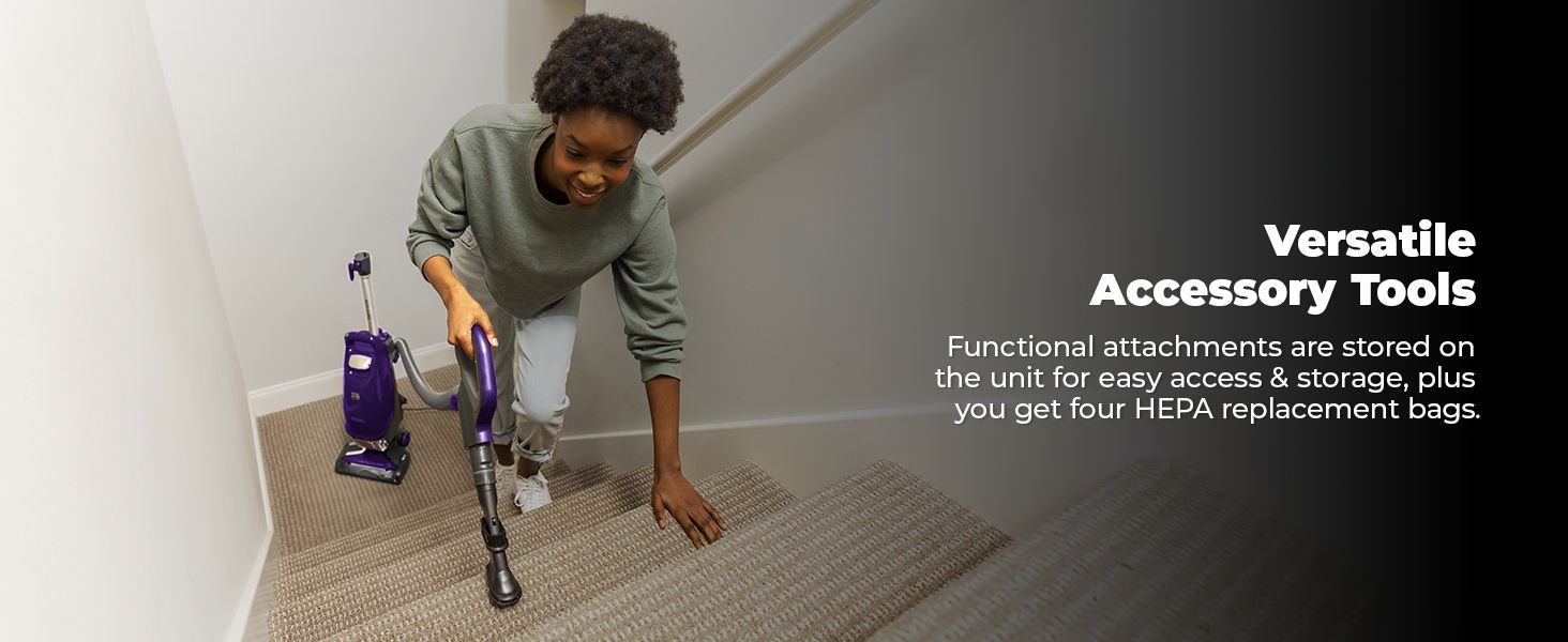 Person cleaning stairs with a vacuum, showcasing versatile accessory tools.
