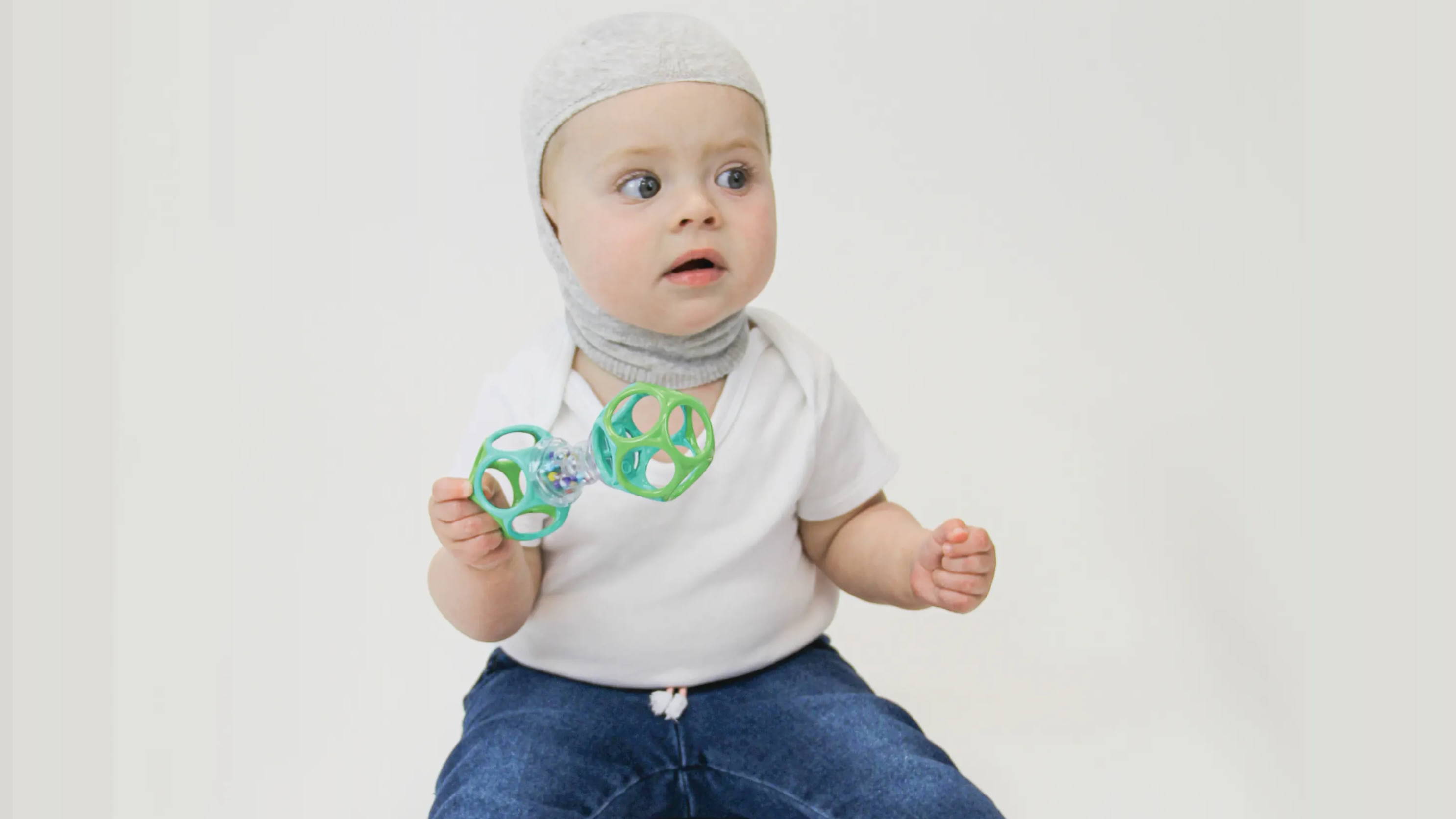 Infant wearing a Knit-Rite Cranial Interface designed to prevent irritation  from a cranial helmet
