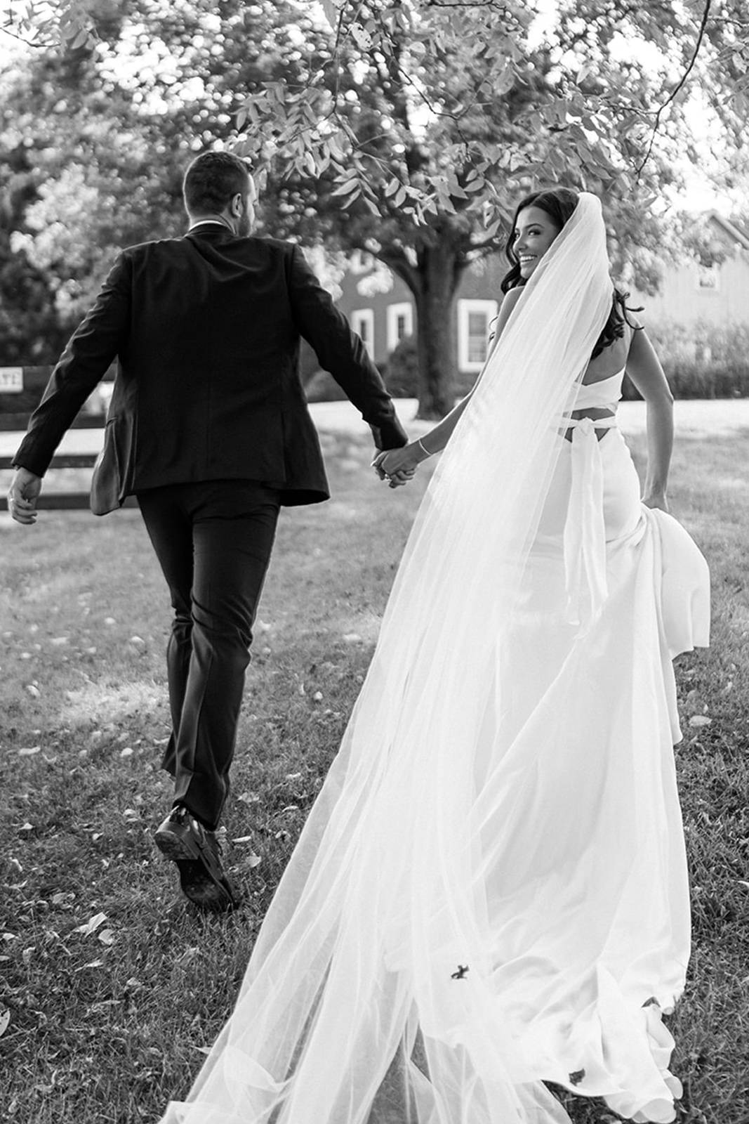 Bride and groom holding hands and walking together