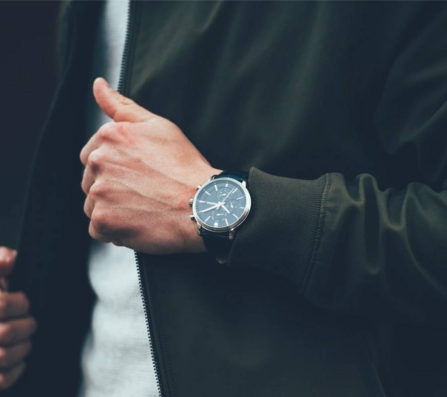 image of man's wrist showing he is wearing a watch