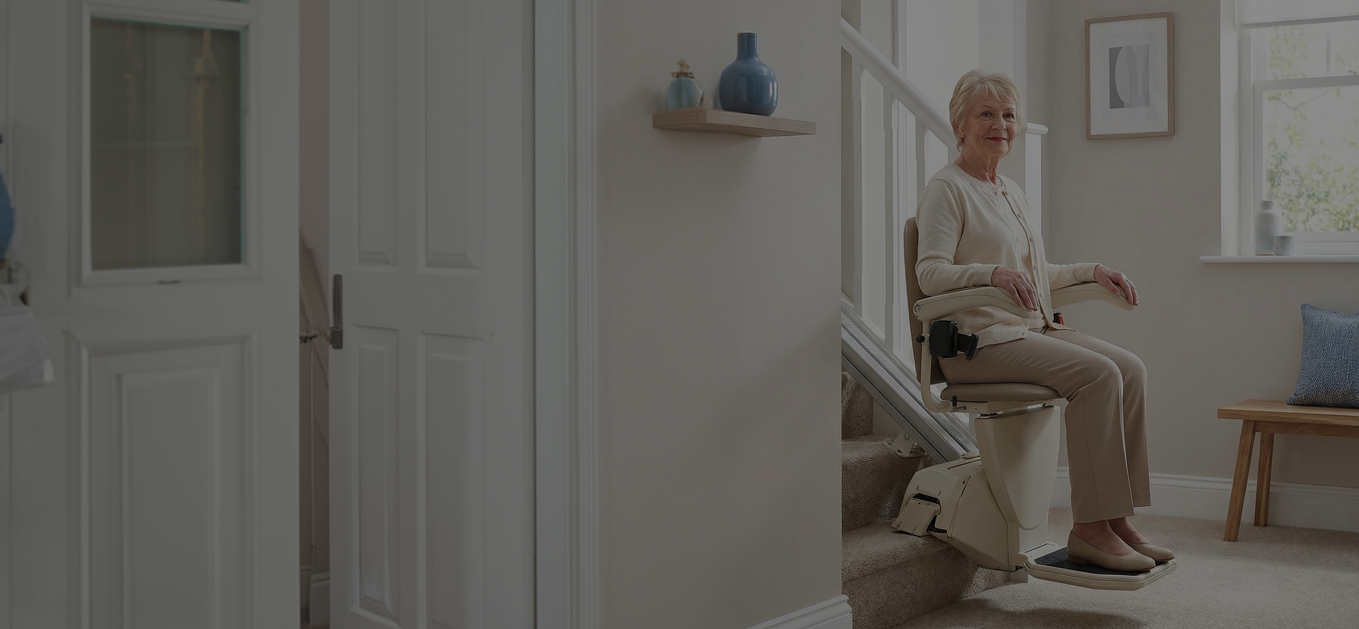 Senior woman riding a stairlift comfortably at home