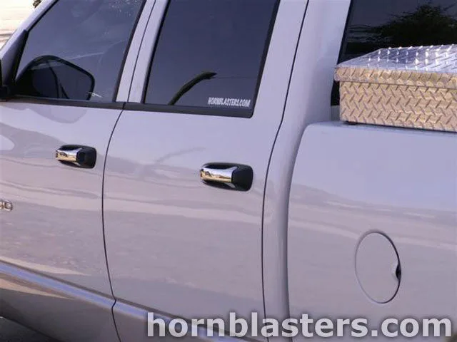 Close-up detail of Shocker XL train horn hardware on Travis's truck
