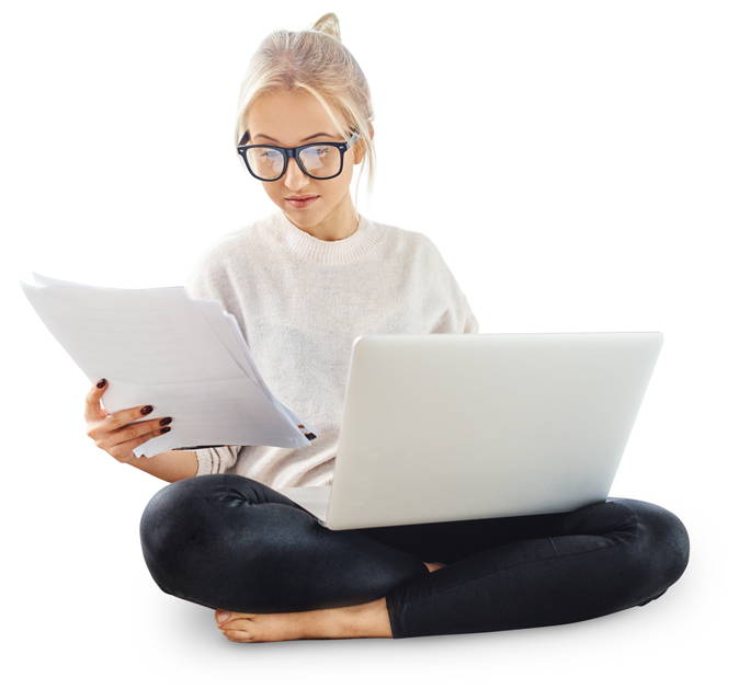 lady with laptop looking at papers