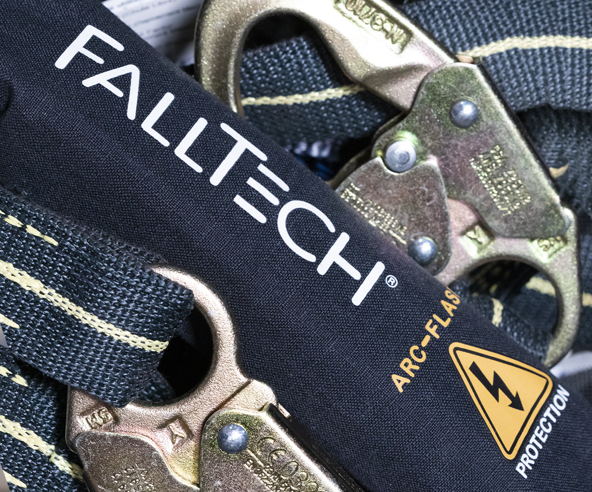 Arc flash and welding energy absorbing lanyard laid to show the shock pack and snap hooks