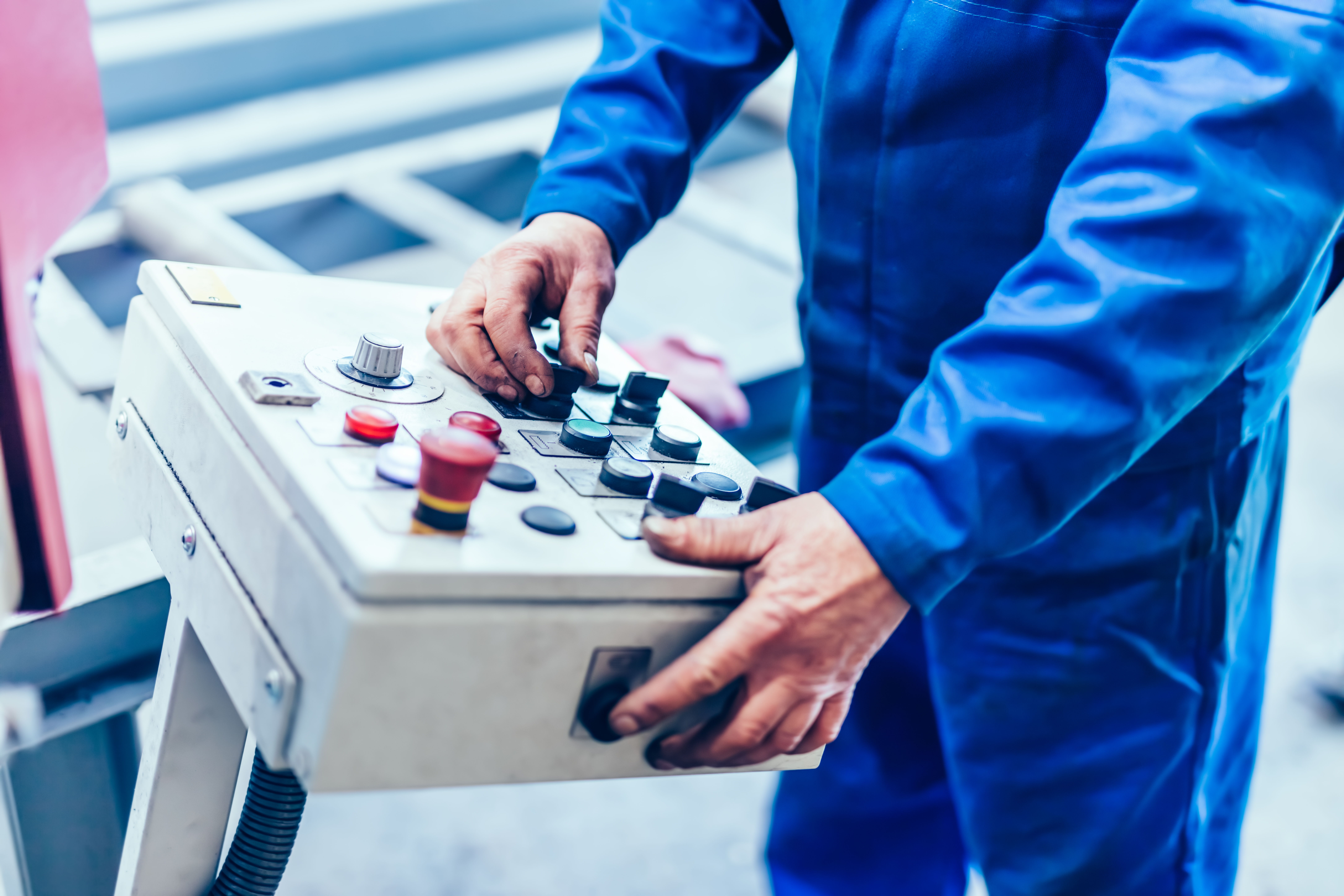 Worker using control panel