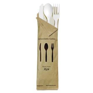 A white CPLA fork, knife,  spoon, and napkin in a paper bag