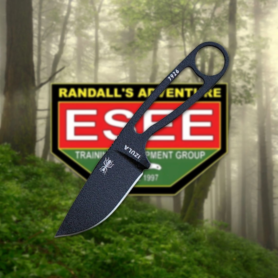 Black knife with logo in a forest background.