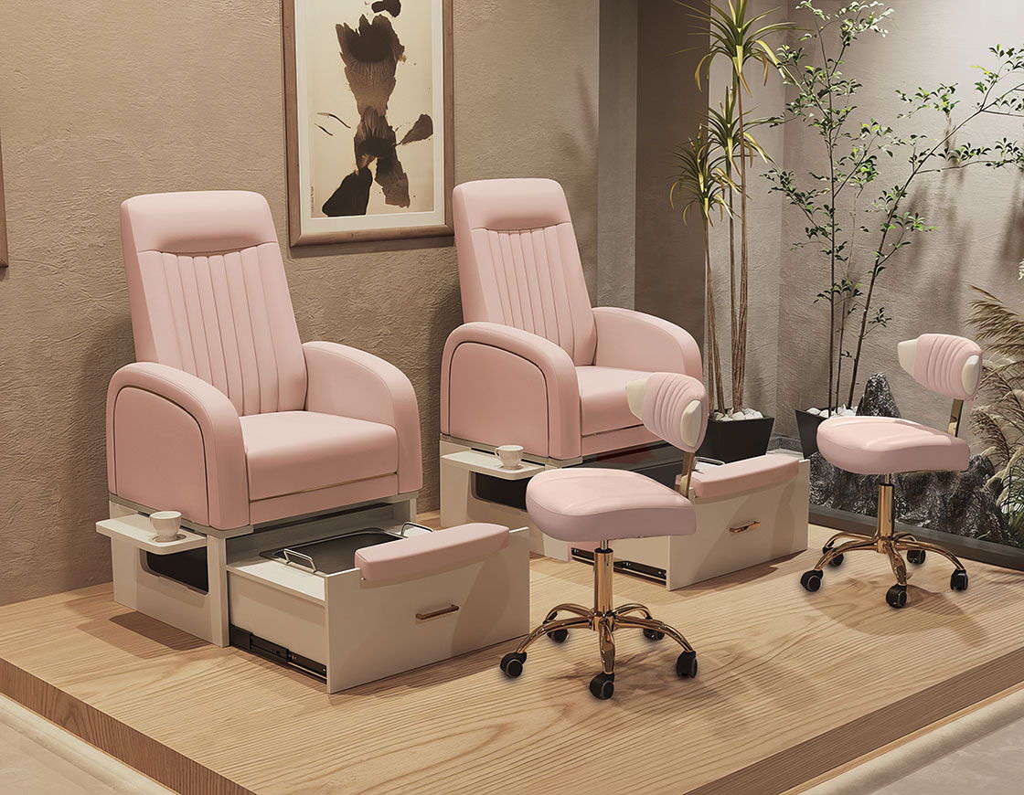 Two pink pedicure chairs in a modern salon setting.