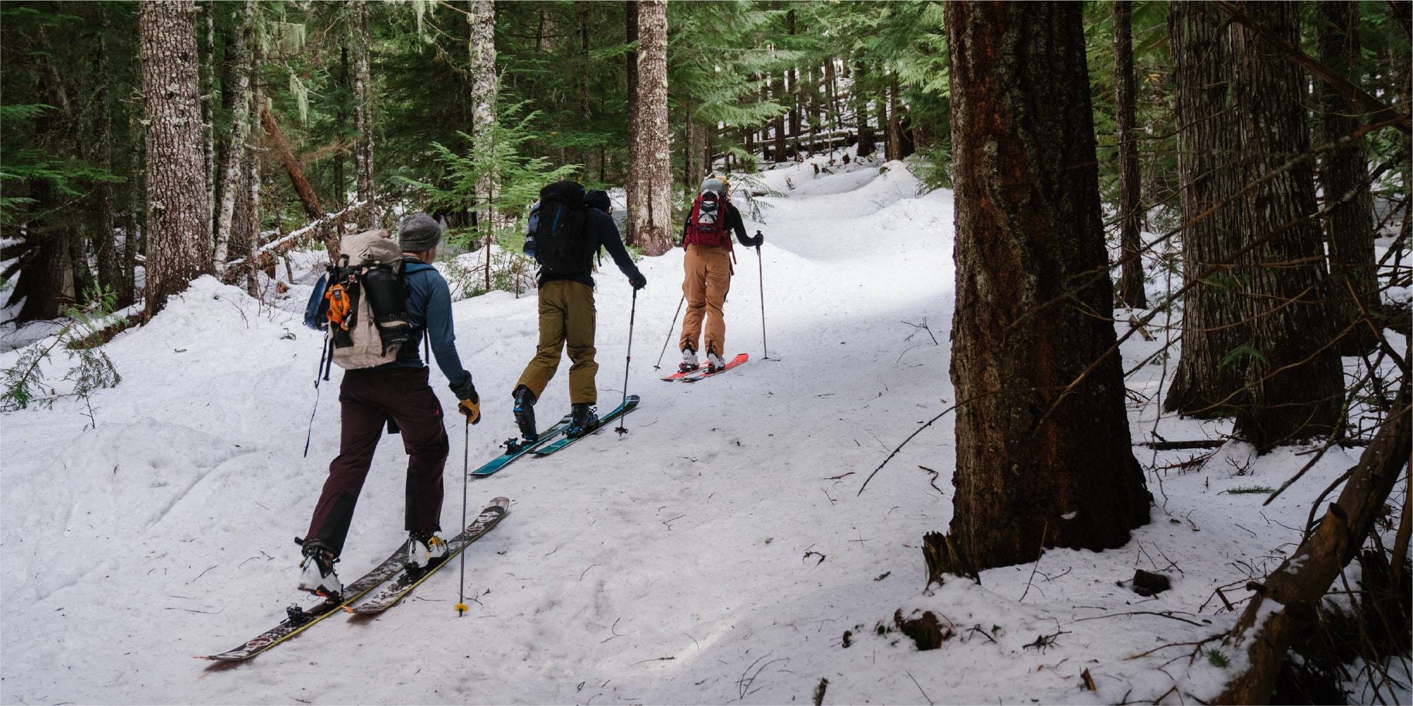 Three people cross country skiing in Mt. Hood with Rumpl blankets