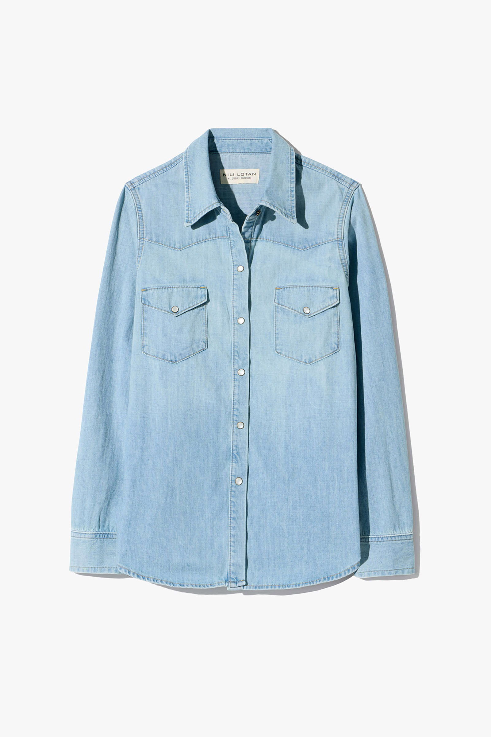 Light blue denim shirt with two chest pockets and button-down front.