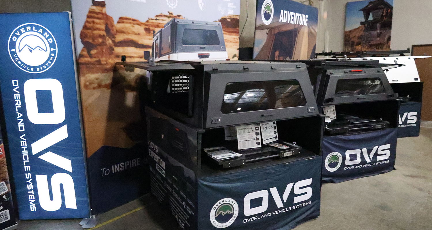 OVS display booths with products in a trade show setting.