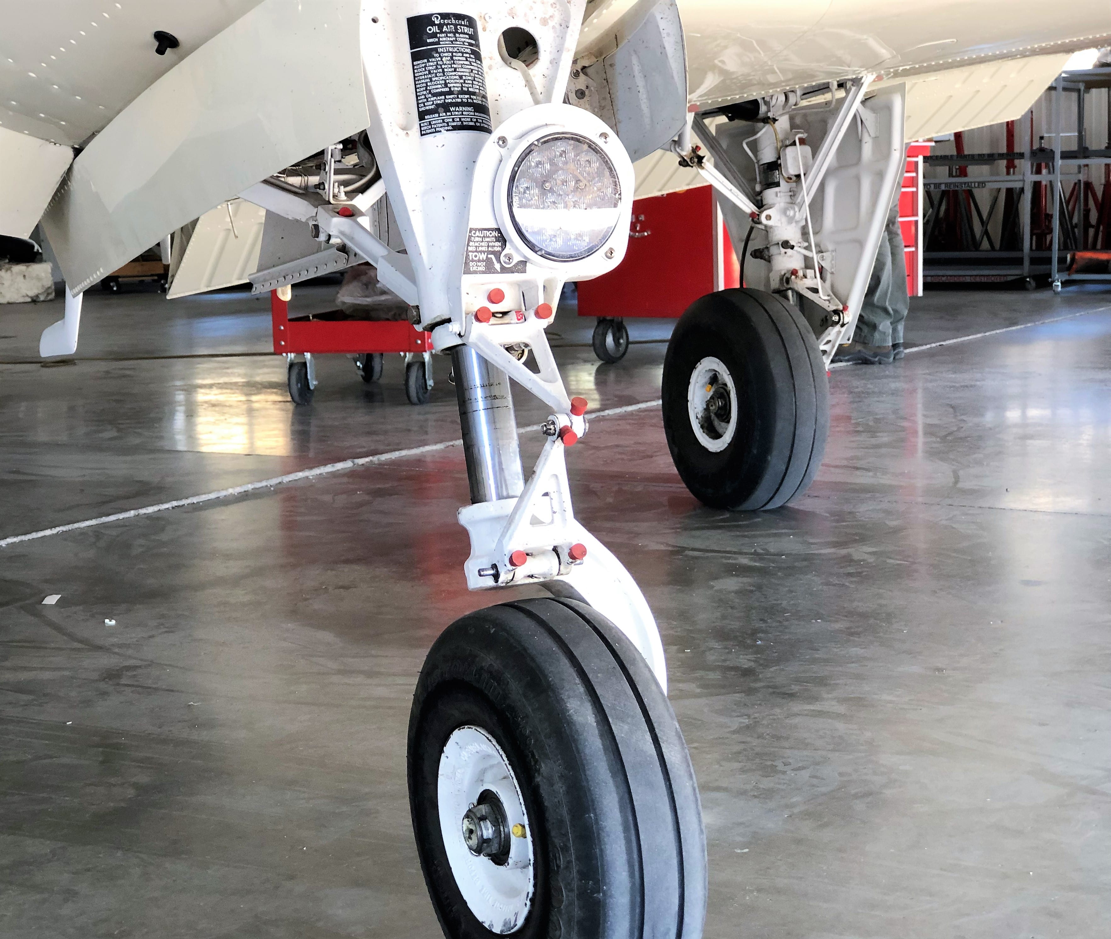 Nose gear and main gear on the hangar floor