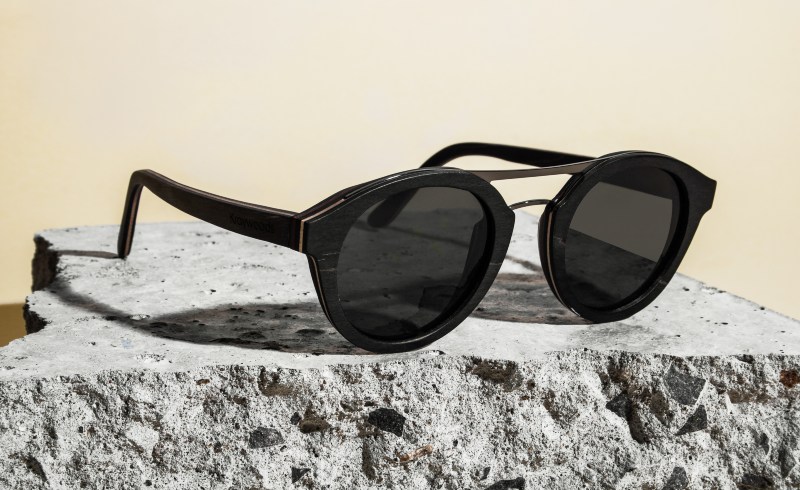 flat lay photo of Ash, wood and metal rounded aviator sunglasses