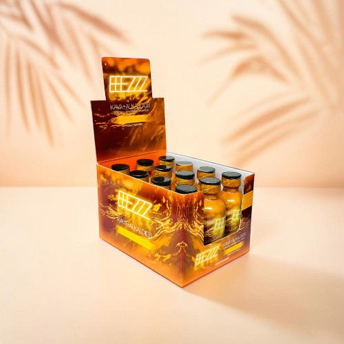 Display of beverage bottles in a colorful box against a soft background.