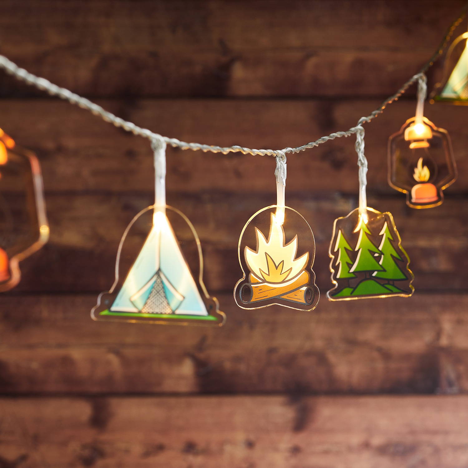 Camping themed fairy lights featuring tents, trees and fires