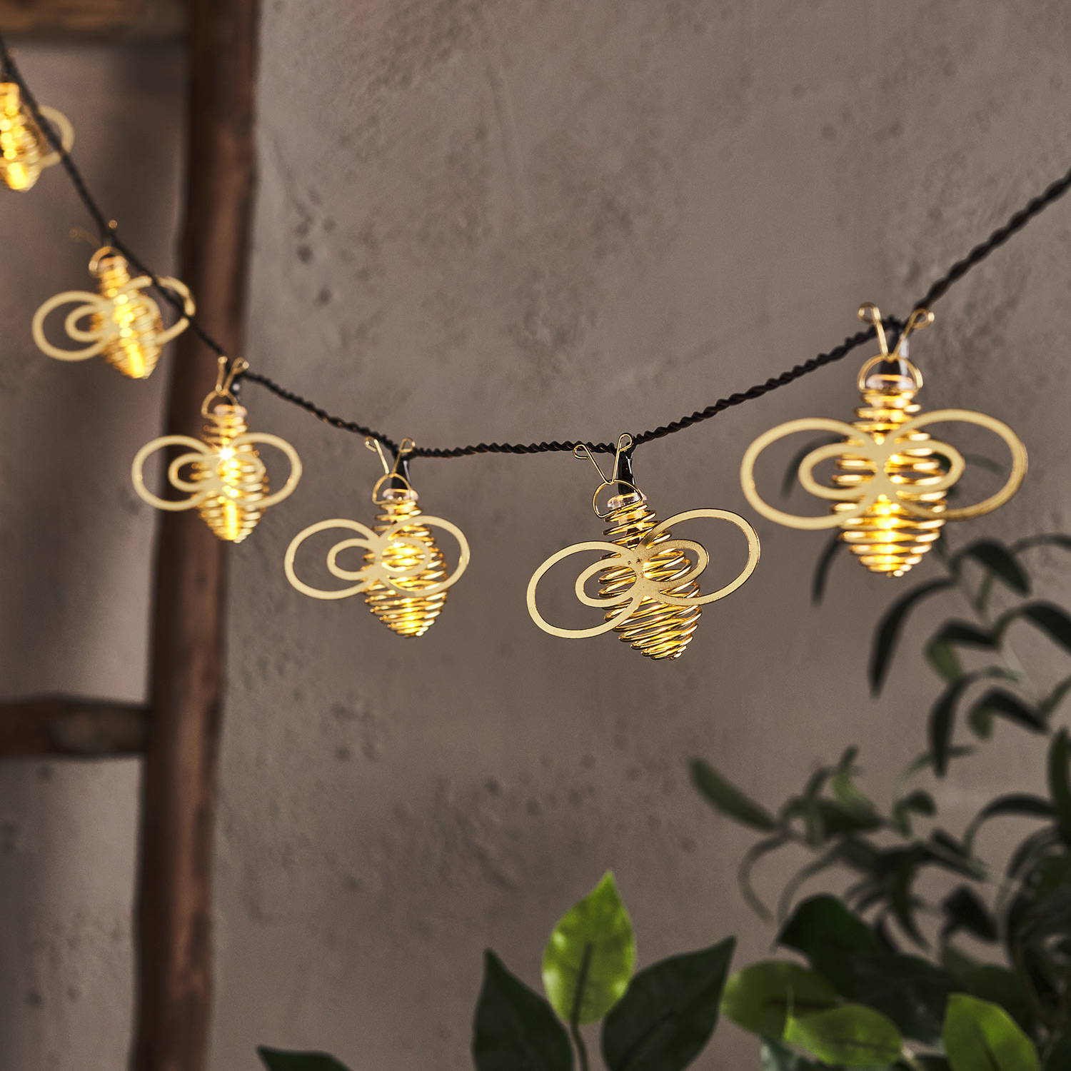 String of outdoor gold bee lights