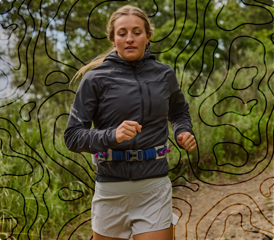 Female trail runner wearing Nathan running apparel