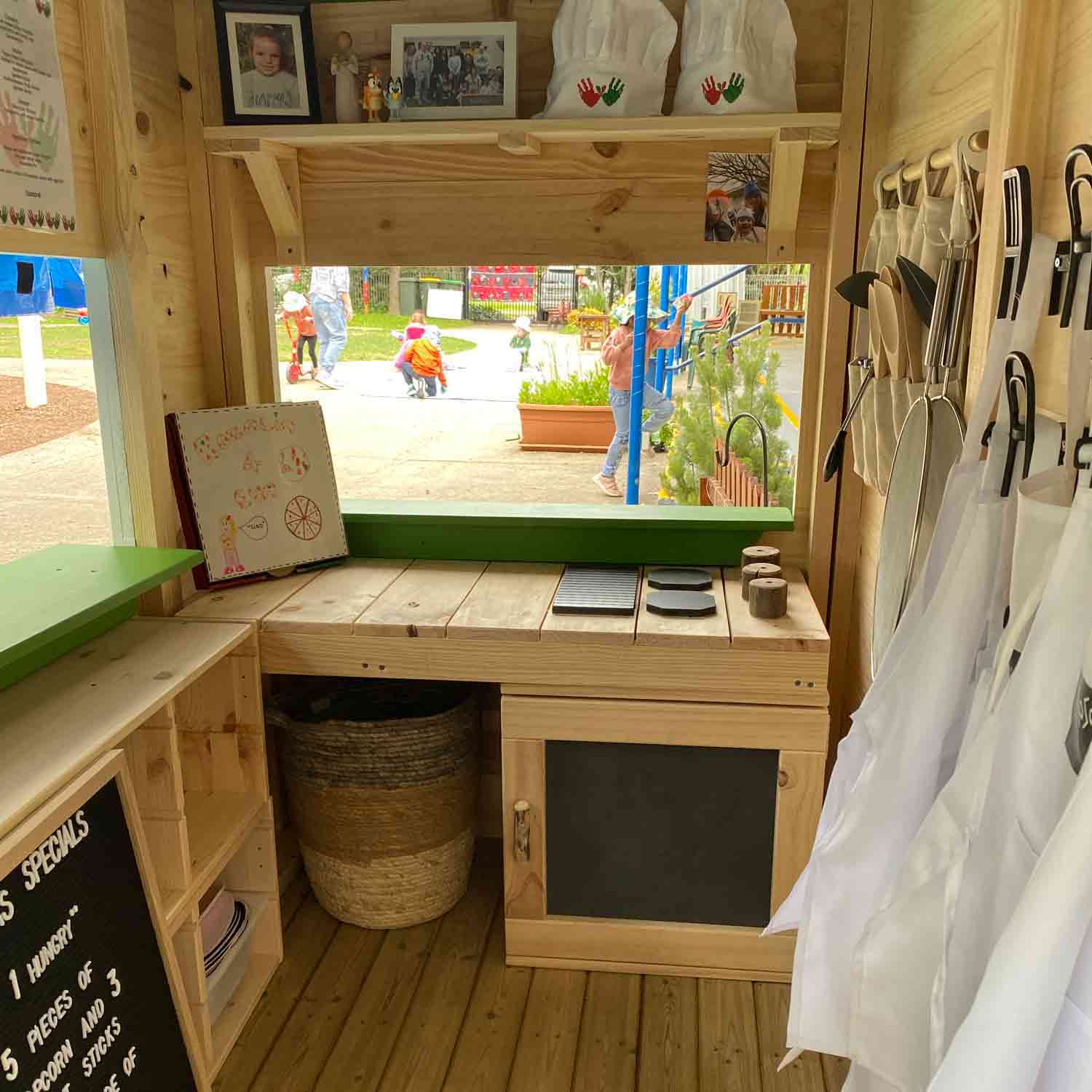 A cubby house interior with a internal mud kitchen