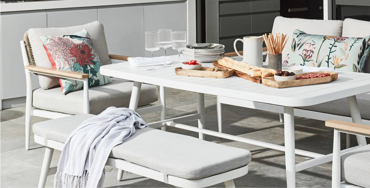 White and grey outdoor dining table and bench
