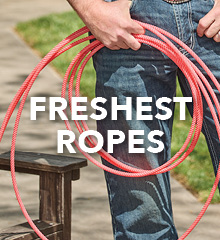 A person holding red ropes with text 