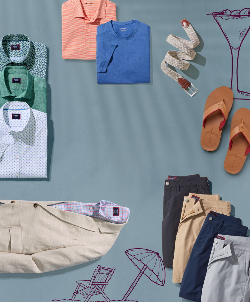 Clothing and accessories arranged on a blue background for summer styling.