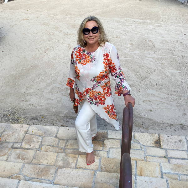 Ala Isham wearing bougainvillea printed silk shirt in Antigua