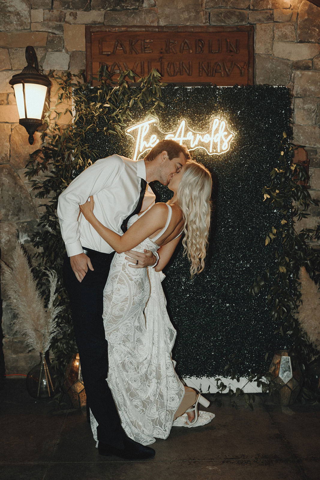 Bride and Groom sharing a kiss at wedding reception