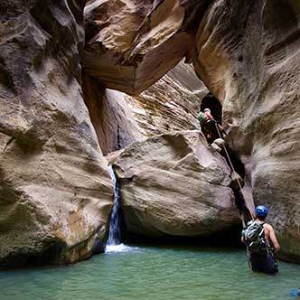 canyoneering through rock and water canyons
