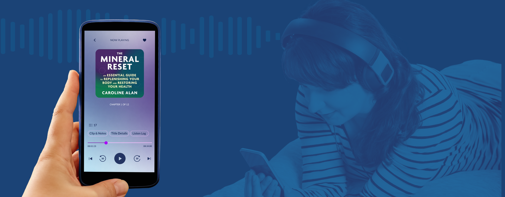 A hand holding a smartphone displaying a music app interface.