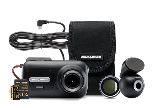 Camera kit with accessories including a charger, carrying case, and lens filter.
