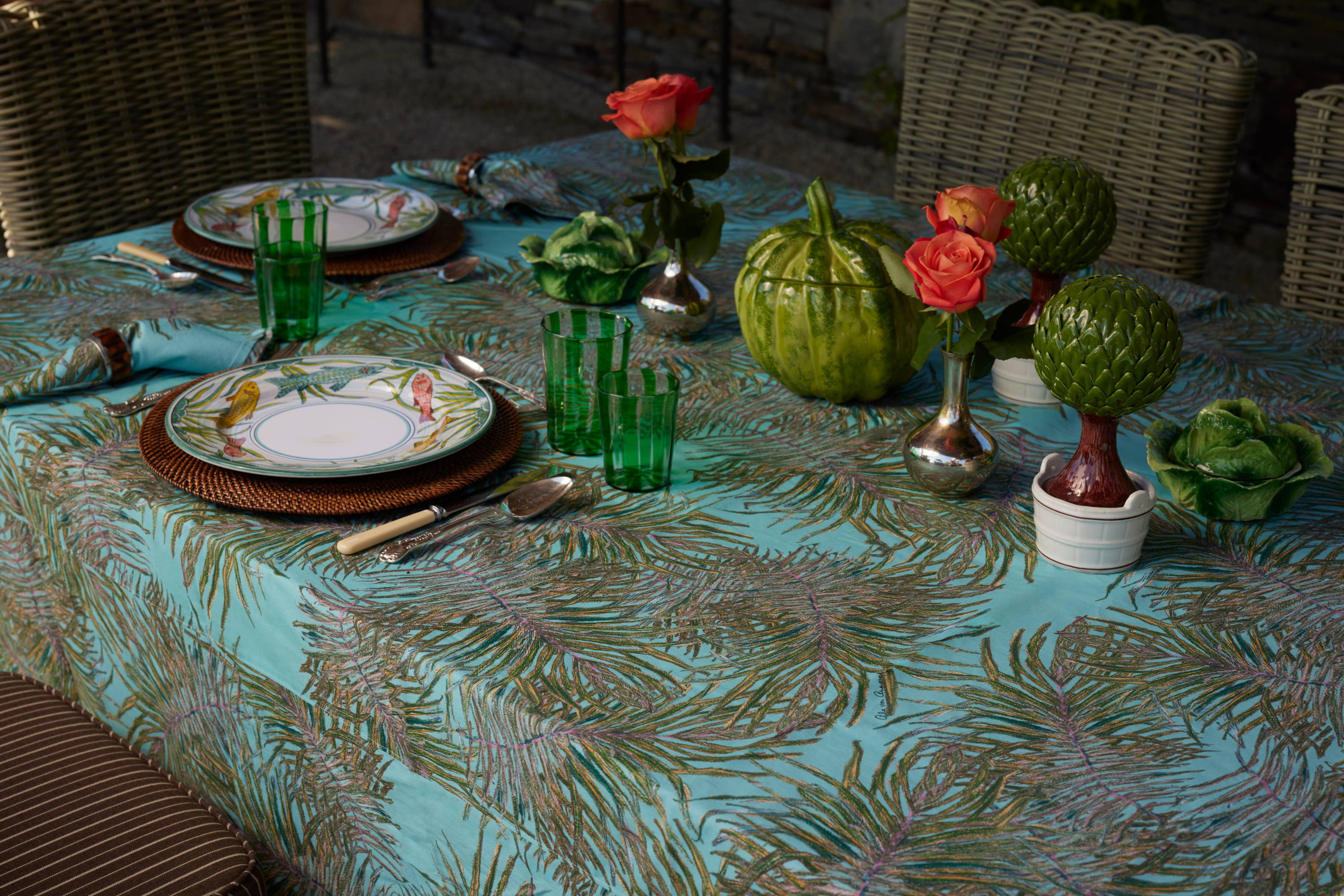 Green palm leaf printed table cloth with matching cotton napkins set on a table in Newport Rhode Island by Ala von Auersperg