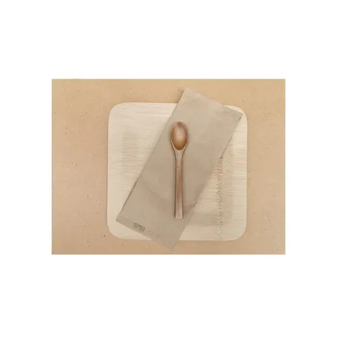 A brown paper placemat with a plate and spoon on top