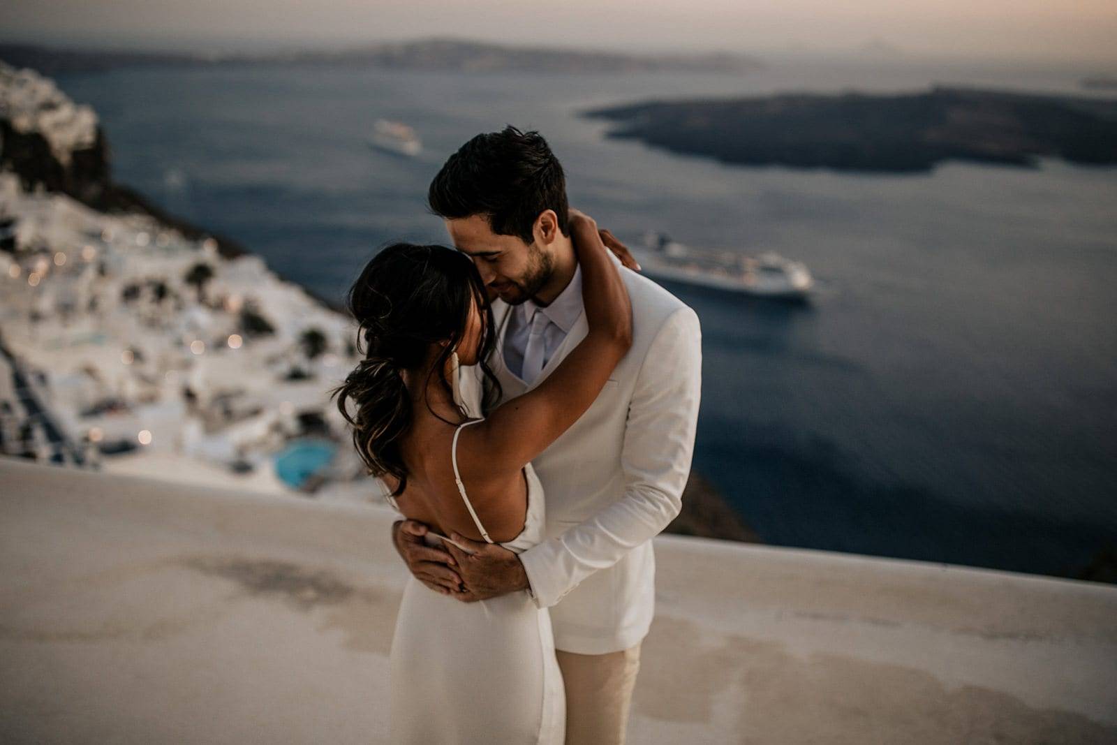 Bride and groom hugging in Santorini Greece