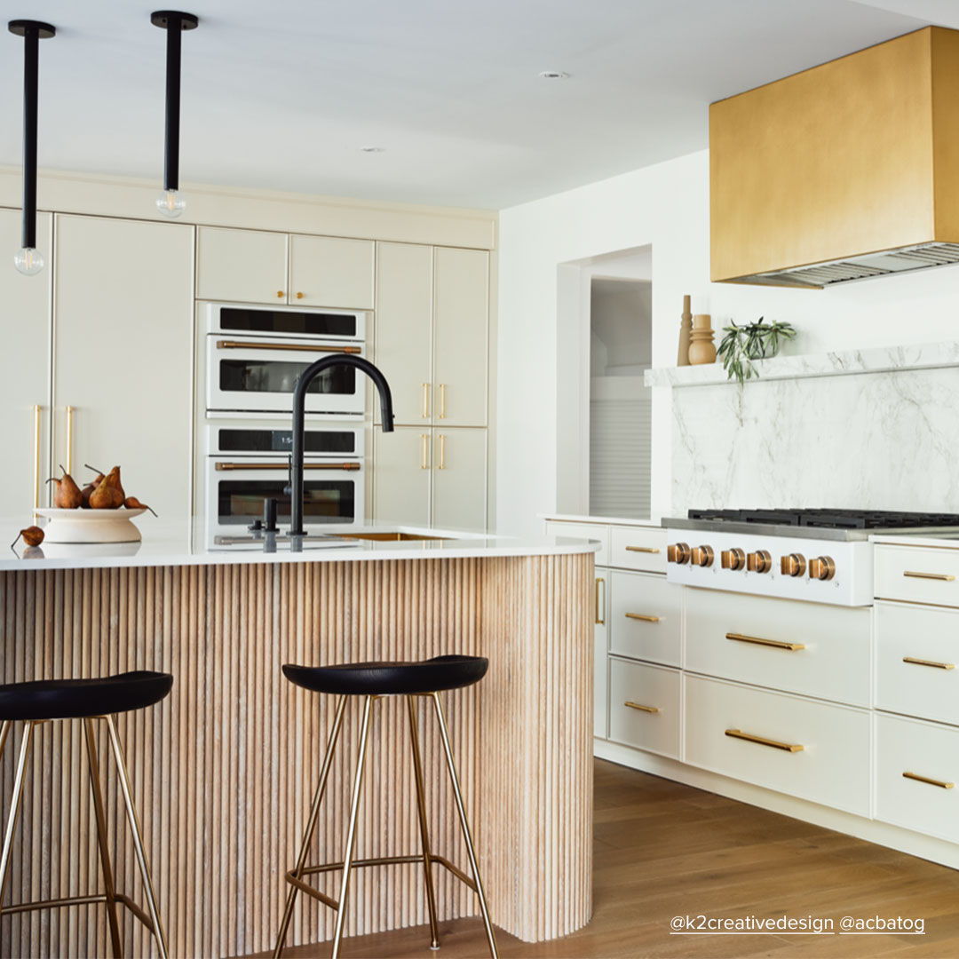 Modern kitchen with an island, sleek cabinetry, and stylish bar stools.