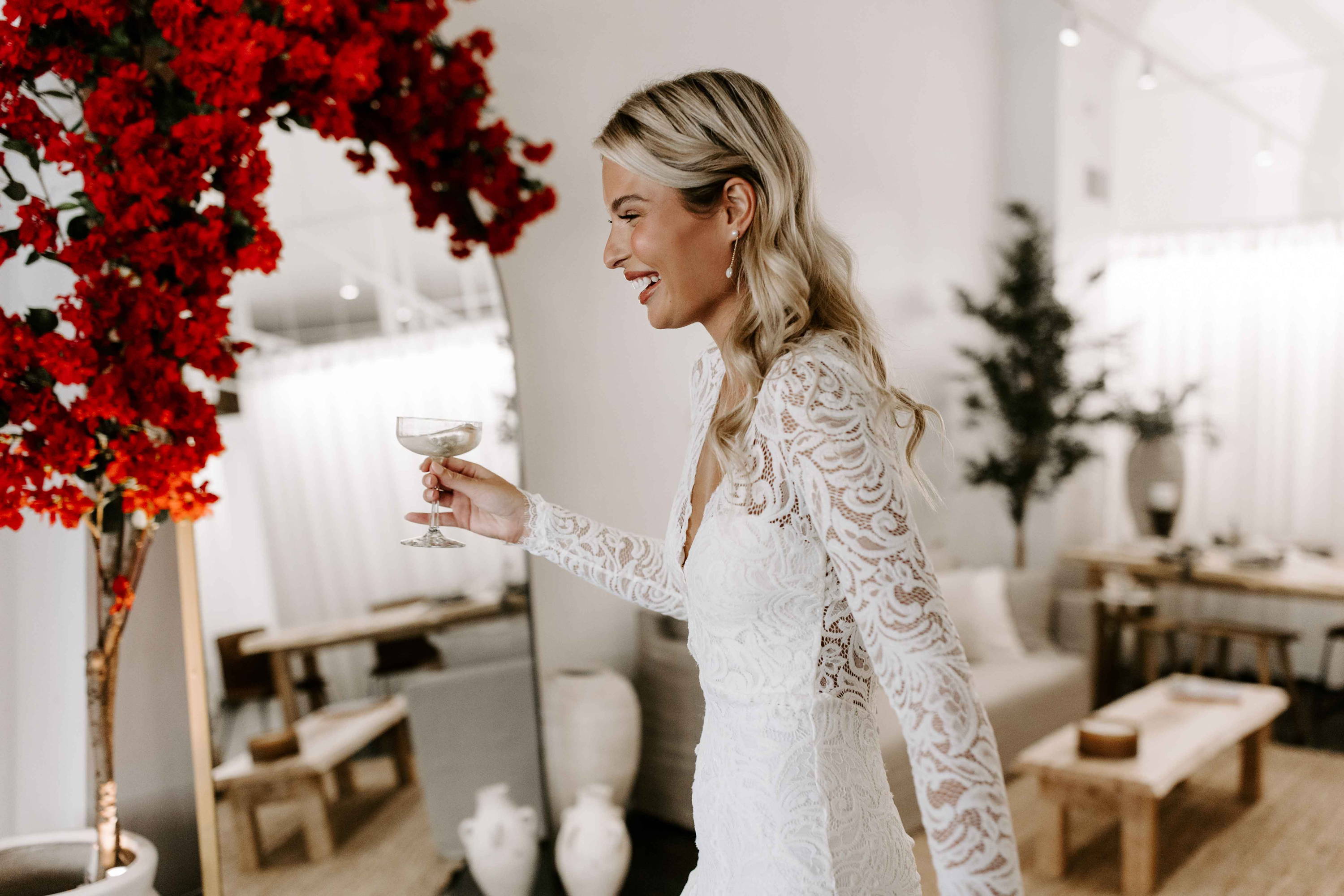 Bride holding champagne in Columbus Showroom