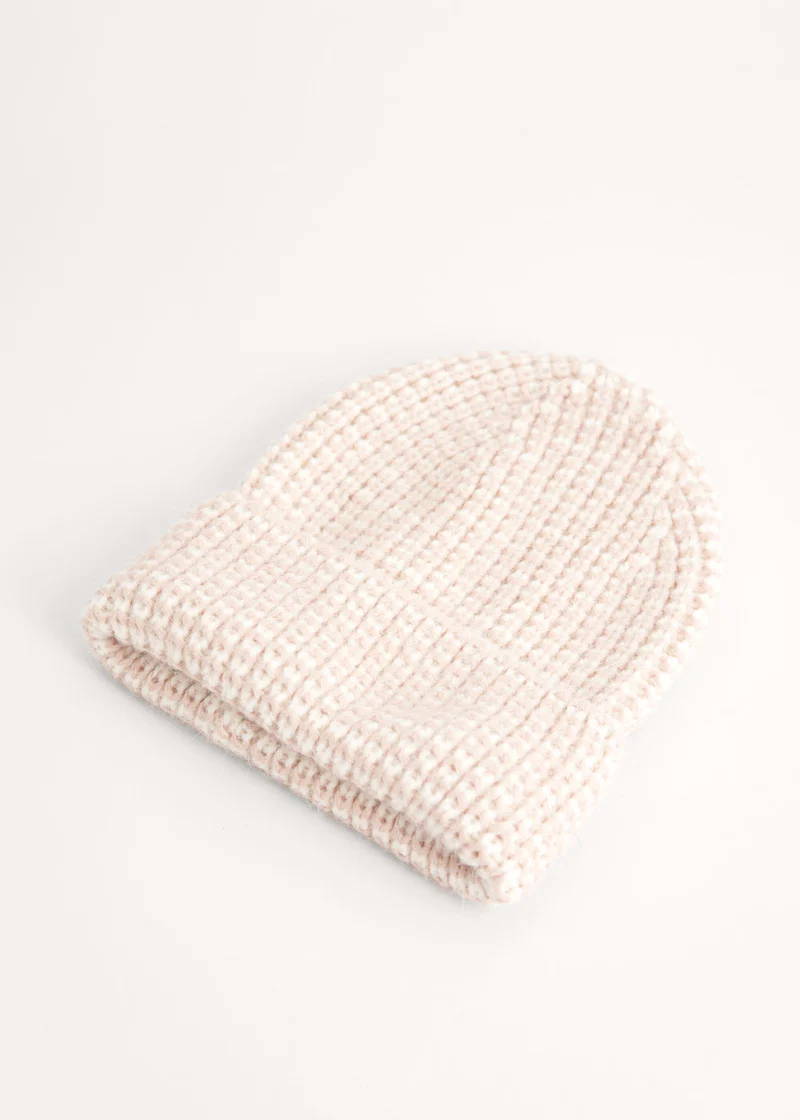 A knitted chunky bean in an off white tone