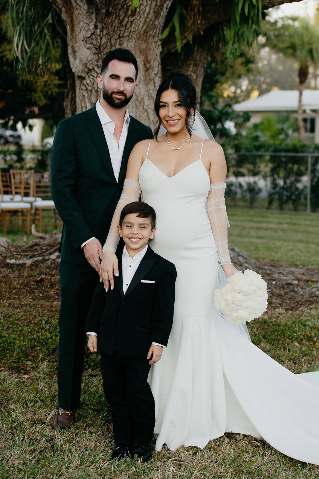 Family picture with bride, groom and a young boy