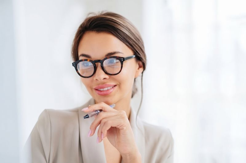 woman wearing Noa tortoise acetate eyeglasses