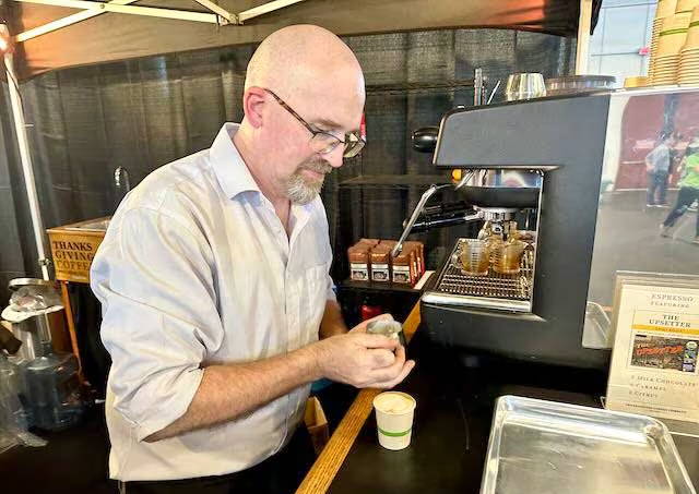 Man pouring espresso shot 