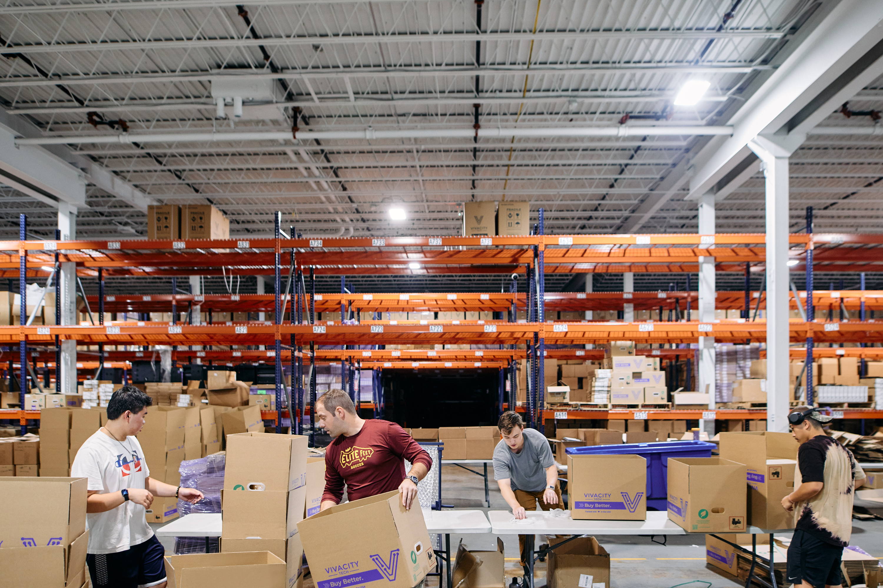 Vivacity Employees packaging green ship boxes