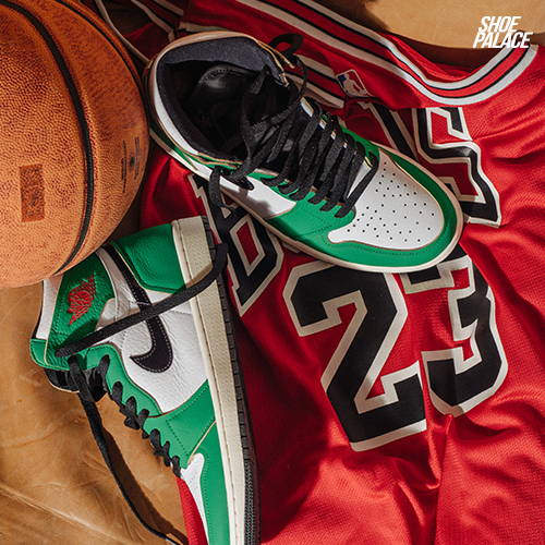 green jordan shoes on top of jordan jersey and basketball
