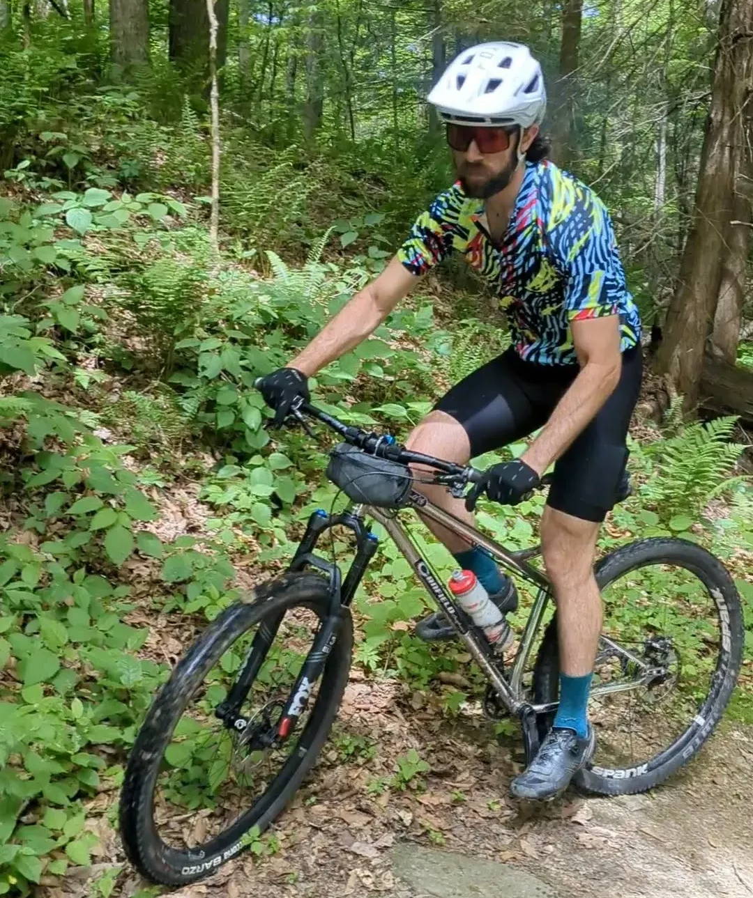 MTB riding in the woods in an Aero Tech Designs Jersey