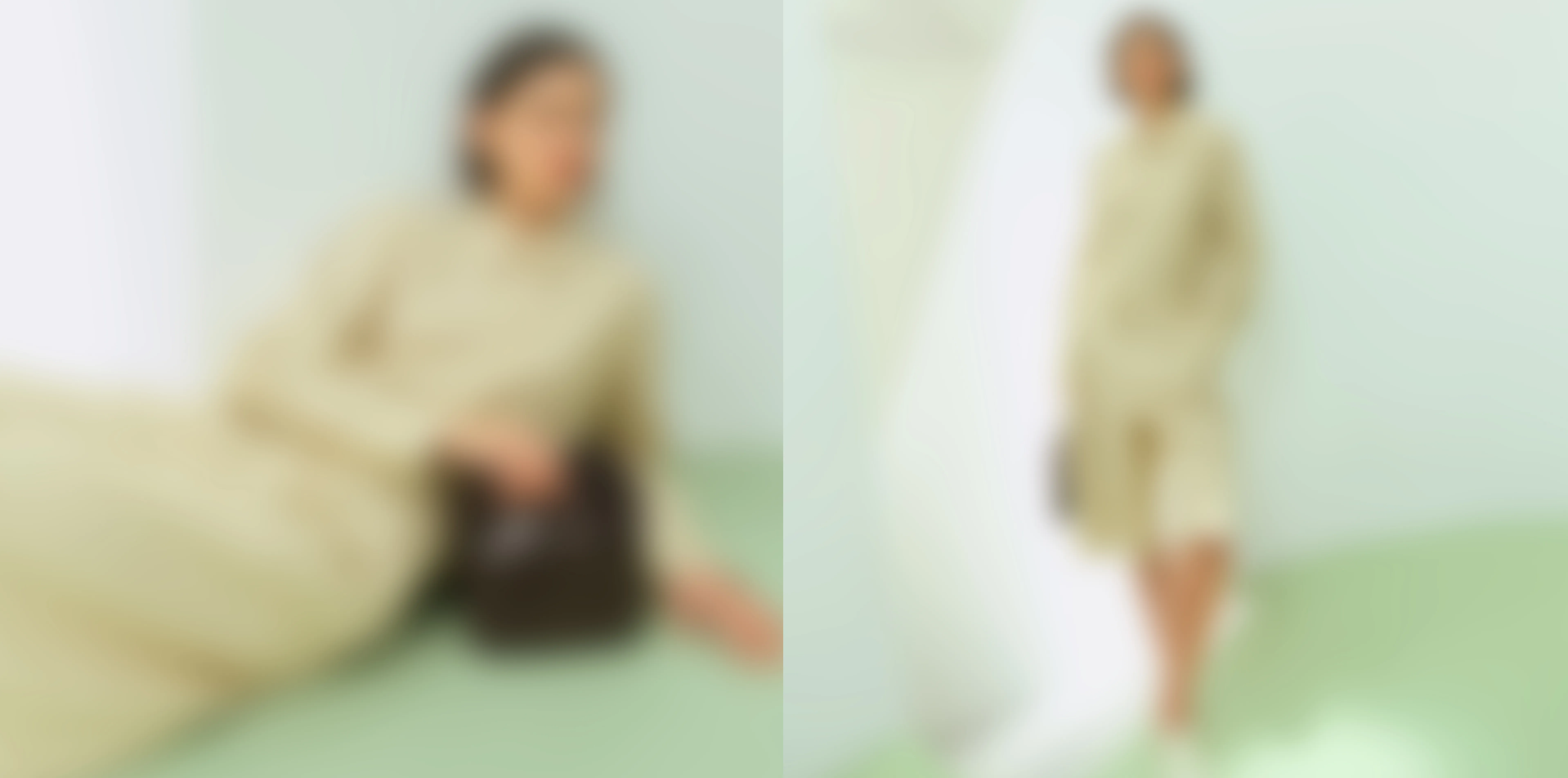 A woman in a beige outfit posing in a softly lit room.