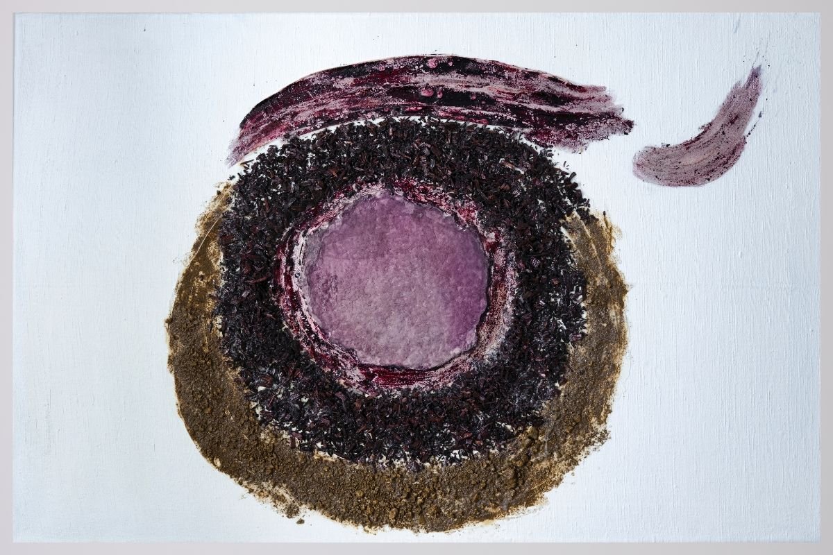 Abstract circular artwork with layered textures and colors.