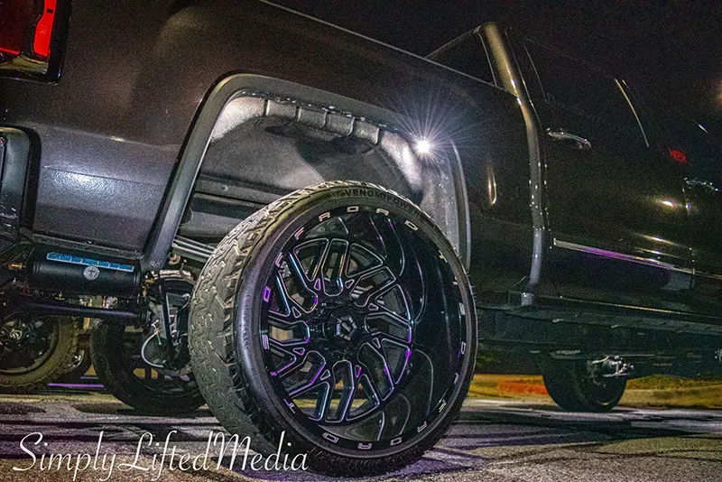 Side profile of 2016 GMC Sierra 1500 with Conductor's Special Spare Tire Delete train horn install HornBlasters gallery photo 2