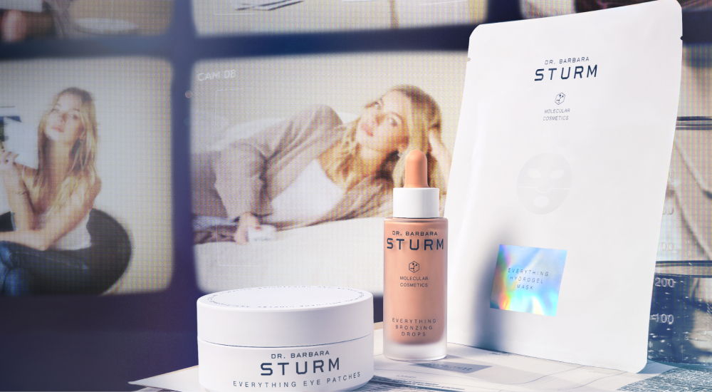 Beauty products displayed with a woman in the background.
