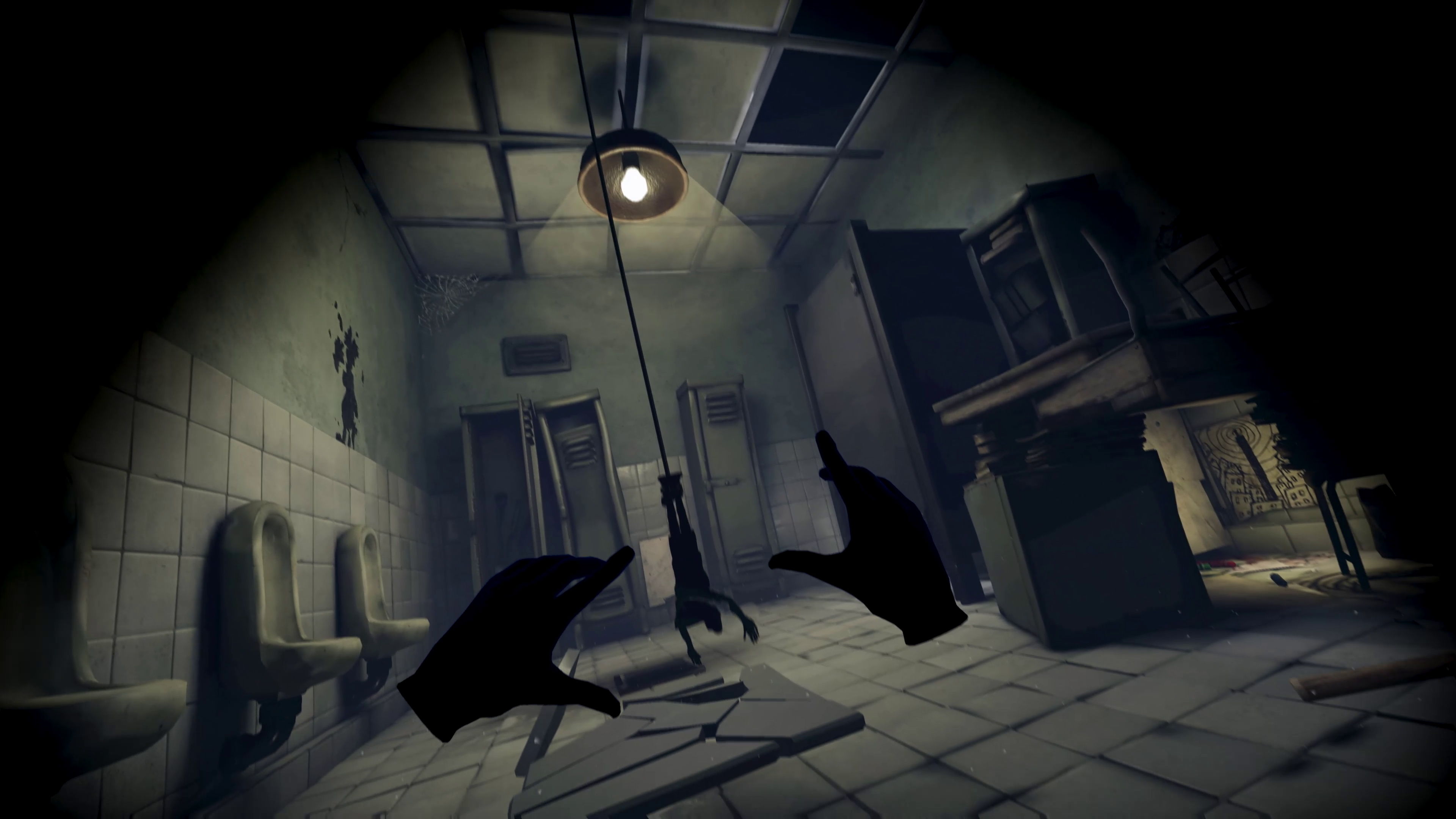 A dark, eerie room with outstretched hands and a hanging object.