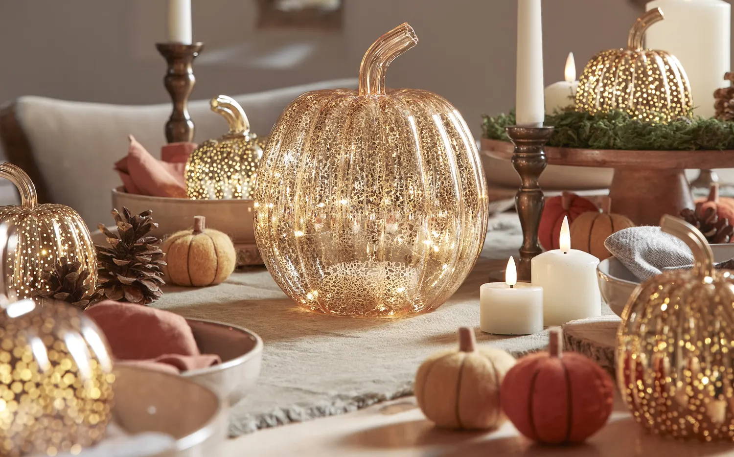 Autumn table with light up pumpkins and LED candles