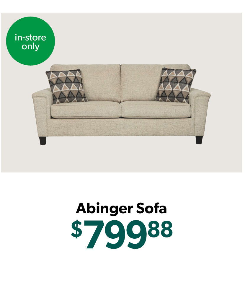 Beige sofa with patterned cushions, priced at $799.88, in-store only.