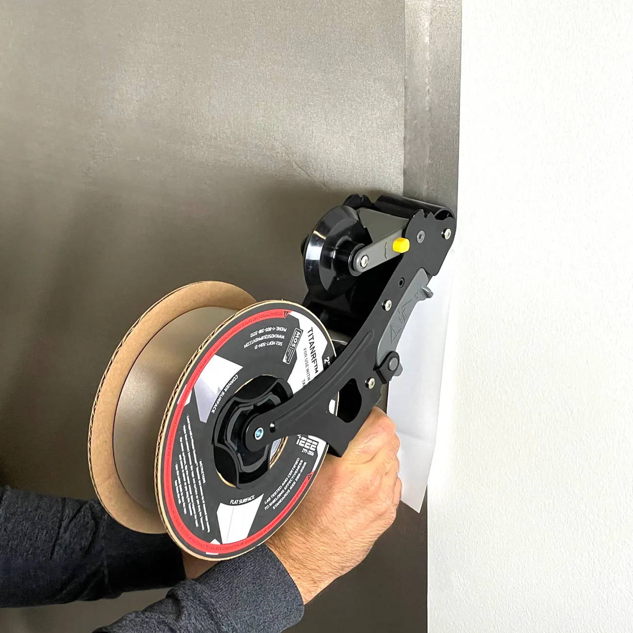 Mission Darkness Taperator applies tape to flat surface for RF shielded rooms and tents, construction projects, and connecting TitanRF™ Faraday fabric sheets